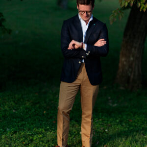 Navy blazer with caramel brown cotton linen trousers
