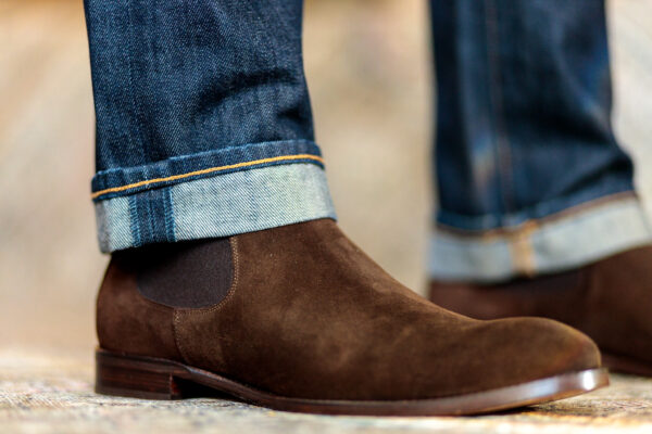 Beckett Simonon chocolate suede Bolton Chelsea boot, close up with dark cuffed denim